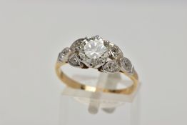 A YELLOW METAL DIAMOND RING, centring on an eight claw set, round brilliant cut diamond, estimated