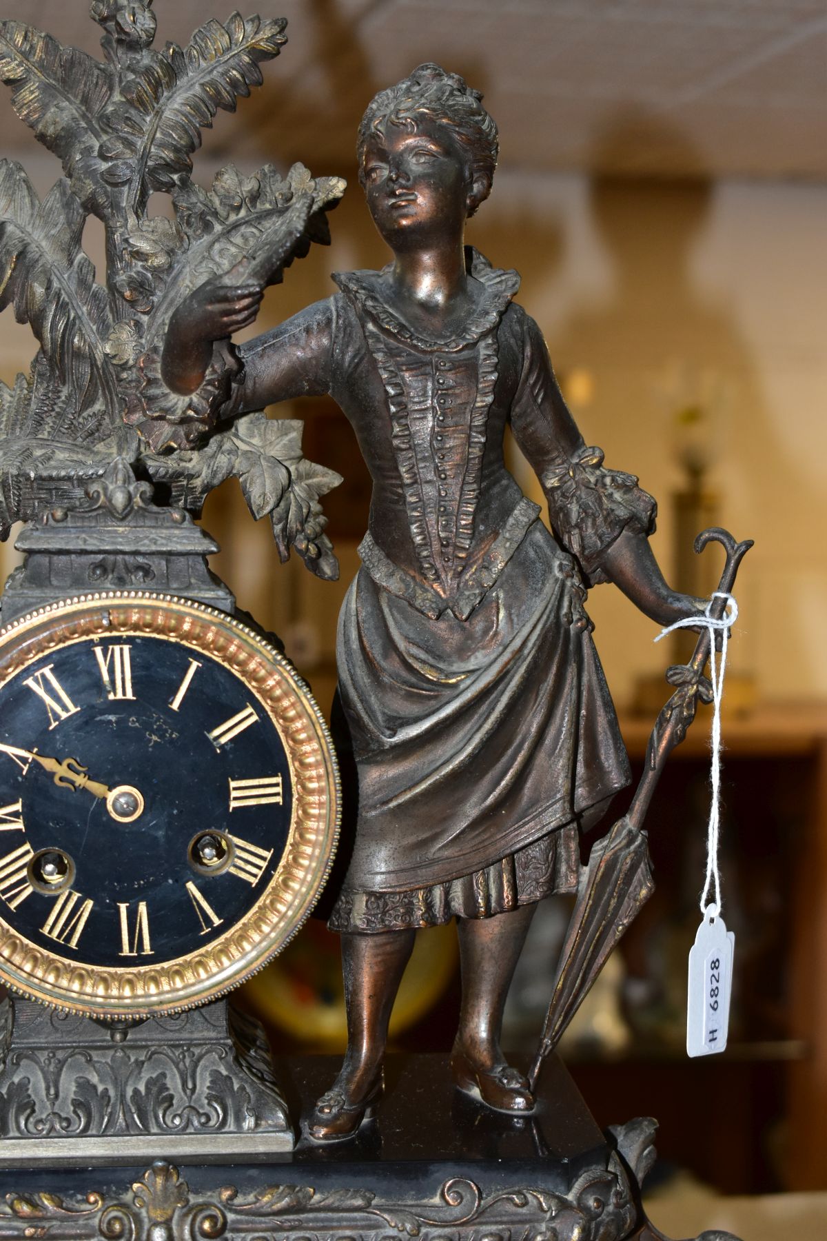A LATE 19TH CENTURY BRONZED SPELTER AND BLACK SLATE CLOCK GARNITURE, the mantel clock with figure of - Image 6 of 14
