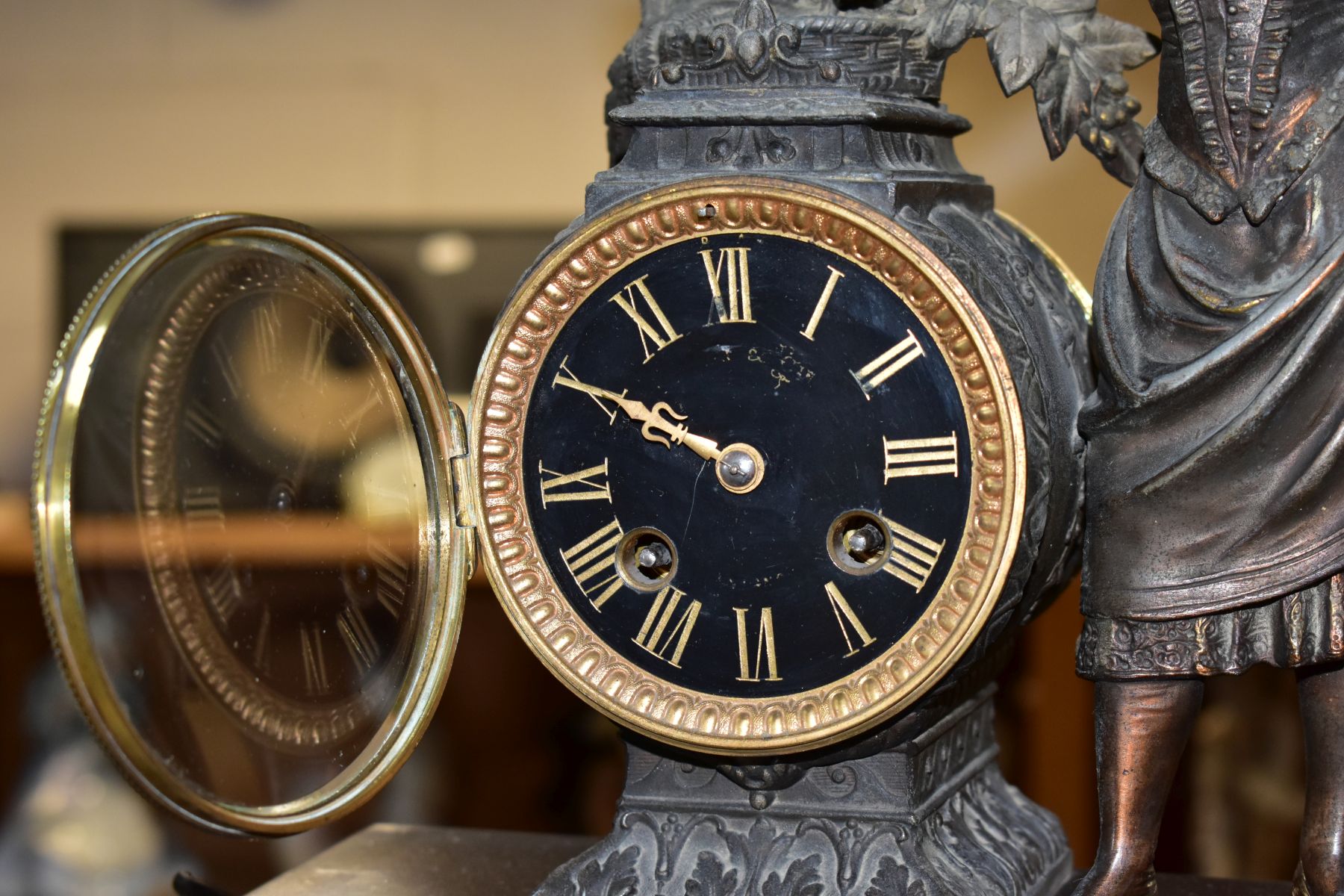 A LATE 19TH CENTURY BRONZED SPELTER AND BLACK SLATE CLOCK GARNITURE, the mantel clock with figure of - Image 7 of 14