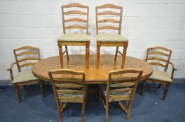 A DUCAL PINE EXTENDING DINING TABLE, extended length 199cm x closed length 154cm and six chairs