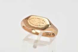 A 9CT GOLD GENTLEMENS SIGNET RING, the signet ring of a rectangular shape and a rubbed engraving, to