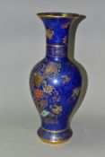 A CARLTON WARE CHINESE STYLE POWDER BLUE BALUSTER VASE, enamelled and gilded with birds and flowers,