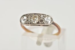 AN EARLY 20TH CENTURY DIAMOND RING, set with three old cut diamonds and four rose cut diamonds,