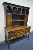 AN OAK DRESSER, with two drawers, turned bulbous front legs united by a H stretcher, width 153cm x