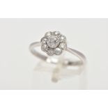A DIAMOND CLUSTER RING, white metal flower shape cluster set with nine old cut diamonds, estimated