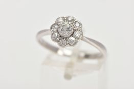 A DIAMOND CLUSTER RING, white metal flower shape cluster set with nine old cut diamonds, estimated