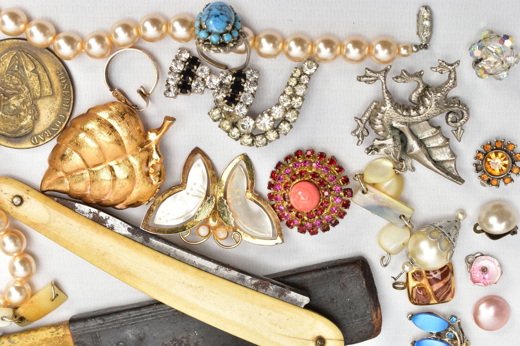 A BOX OF ASSORTED ITEMS, to include a lady's fashion quartz wristwatch, imitation pearl strands, - Image 3 of 7