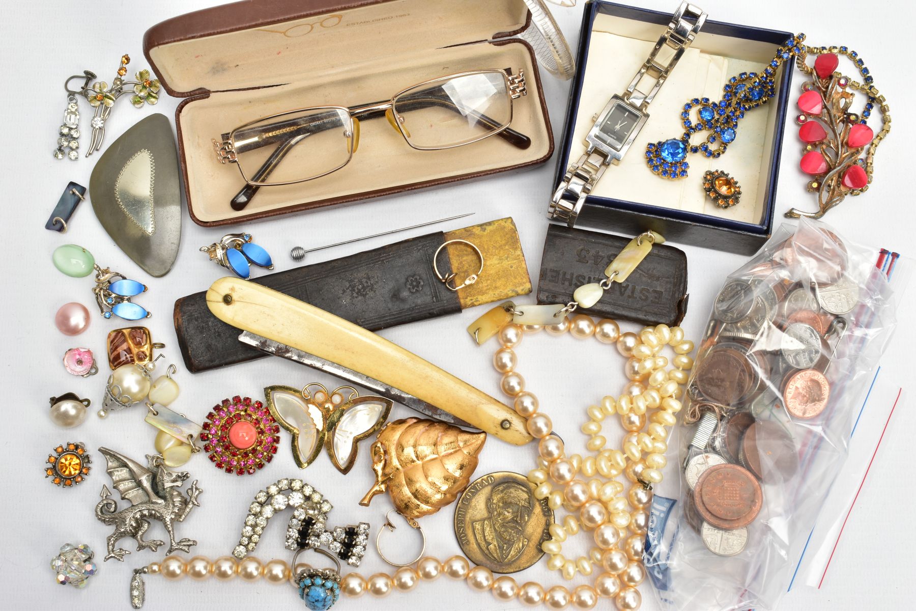 A BOX OF ASSORTED ITEMS, to include a lady's fashion quartz wristwatch, imitation pearl strands,