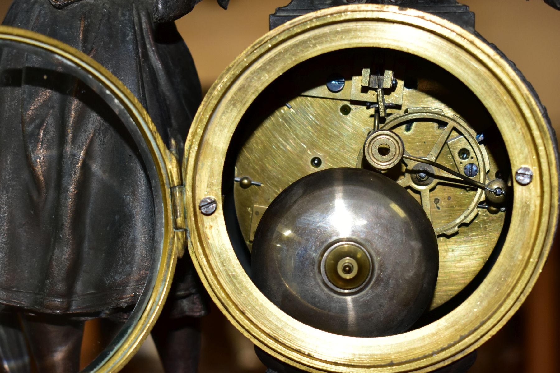 A LATE 19TH CENTURY BRONZED SPELTER AND BLACK SLATE CLOCK GARNITURE, the mantel clock with figure of - Image 12 of 14