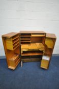 A MID CENTURY TEAK 'MAGIC BOX' FOLD OUT DESK/WORK STATION, BY MUMMENTHALER & MEIER, the double