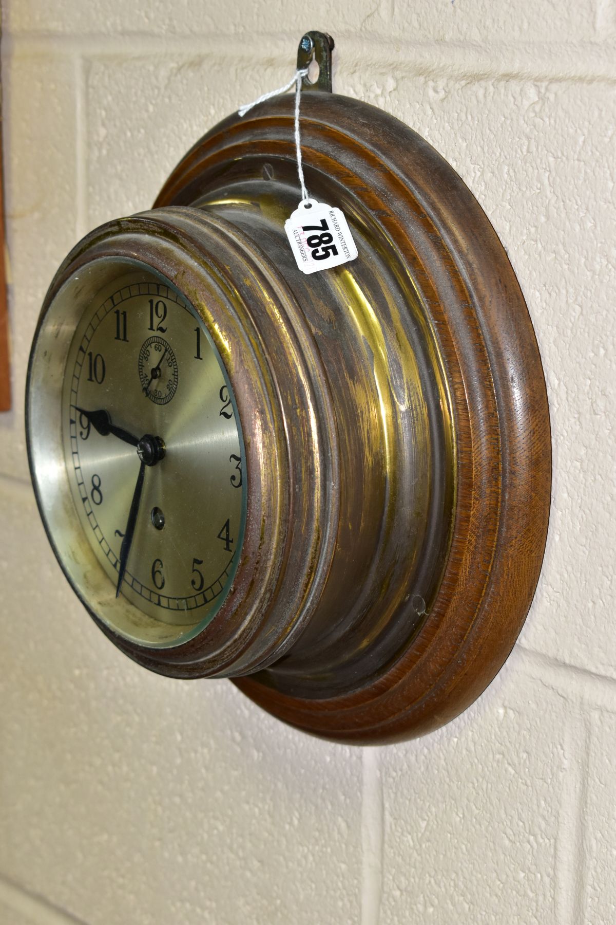 A MID 20TH CENTURY BRASS SHIP STYLE CLOCK, MOUNTED TO AN OAK BOARD, the circular dial having - Image 2 of 3