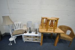 A SOLID LIGHT OAK SQUARE KITCHEN TABLE, with three stools, a wicker basket chair, a standard lamp,