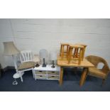 A SOLID LIGHT OAK SQUARE KITCHEN TABLE, with three stools, a wicker basket chair, a standard lamp,