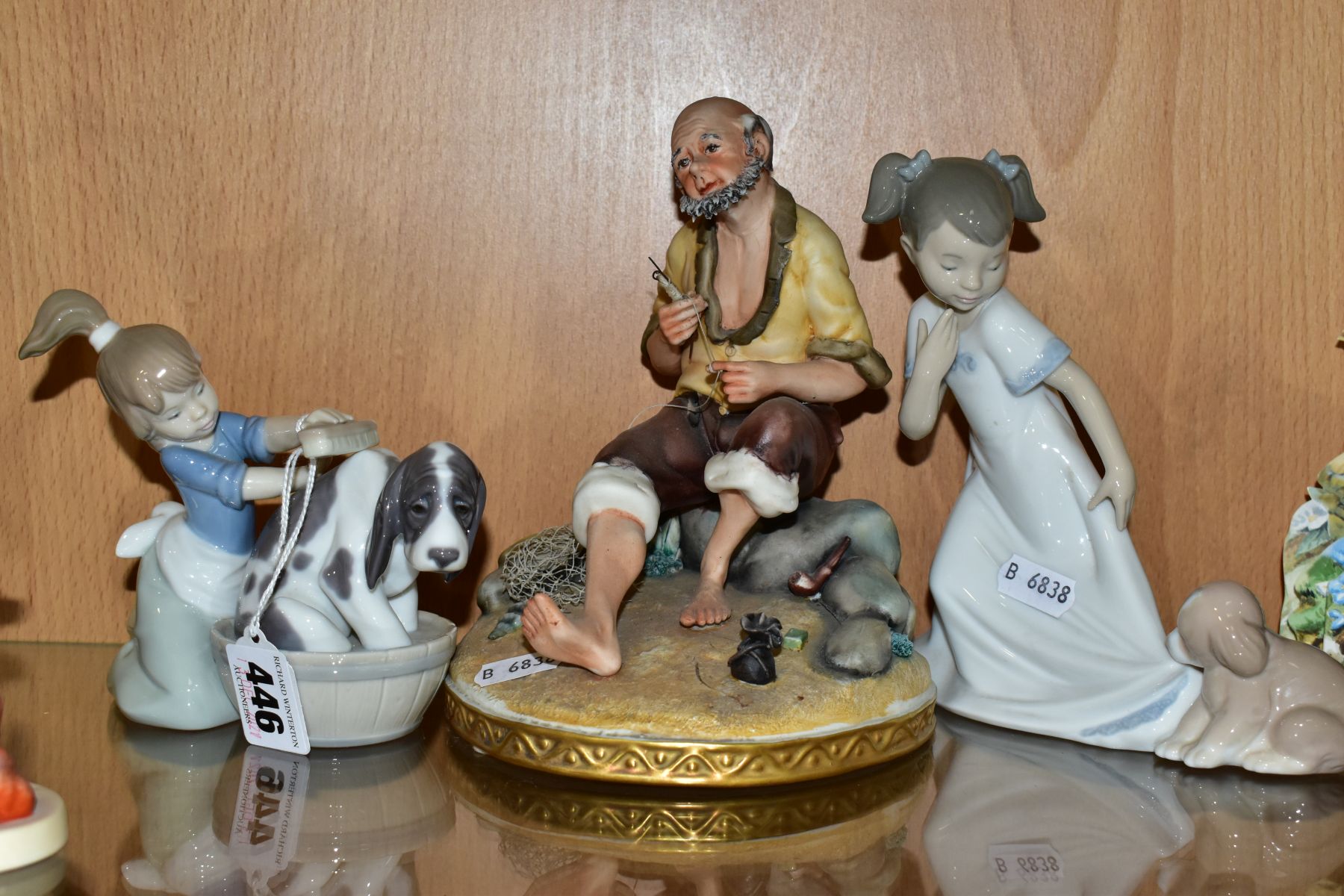 A LLADRO FIGURE AND TWO OTHER FIGURINES BY NAO AND LLADRO, the Lladro figure 'Bashful Bather'