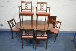 A MAHOGANY TWIN PEDESTAL DINING TABLE, six chairs including two carvers, along with a mahogany