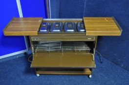 A PHILIPS HO100LB Philips hostess trolley with four Pyrex dishes with heated lids with all