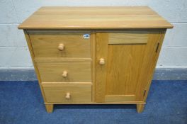 A SOLID OAK SIDE CABINET, with three drawers bedside a single cupboard door, width 84cm x depth 45cm