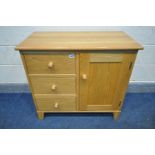 A SOLID OAK SIDE CABINET, with three drawers bedside a single cupboard door, width 84cm x depth 45cm