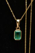 AN EMERALD PENDANT AND CHAIN, an emerald cut emerald, measuring approximately 7mm x 5mm, bezel set