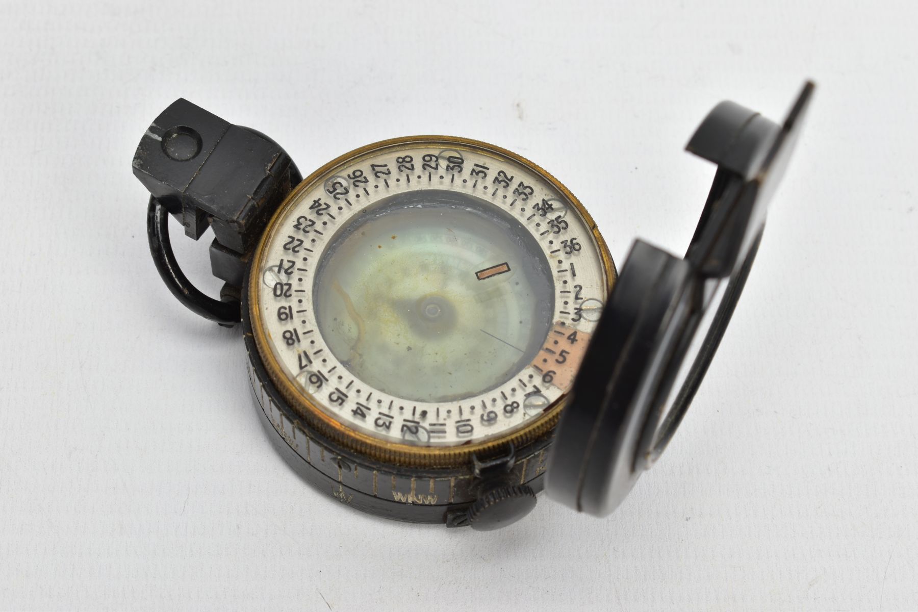A MILITARY COMPASS, black compass, stamped T.G.C2 Ltd London number 234303, dated 1943 MK III - Image 5 of 7