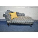 A LATE 20TH CENTURY BLUE AND GOLD FLORAL UPHOLSTERED CHAISE LONGUE, length 137cm
