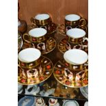 A SET OF SIX ROYAL CROWN DERBY SOLID GOLD BAND IMARI COFFEE CANS AND SAUCERS IN THE 1128 PATTERN,