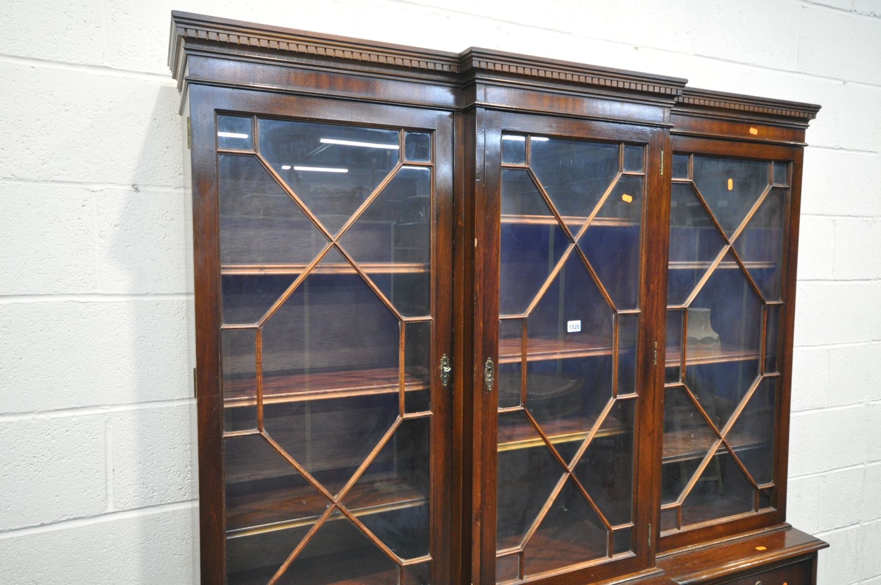 A REPRODUCTION MAHOGANY TRIPLE DOOR BREAKFRONT BOOKCASE, over three drawer and three cupboard doors, - Image 2 of 3