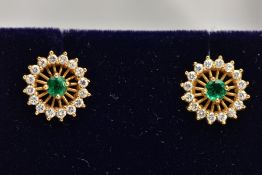 A PAIR OF 18CT GOLD EMERALD AND DIAMOND EARRINGS, each of an openwork circular design, centring on a