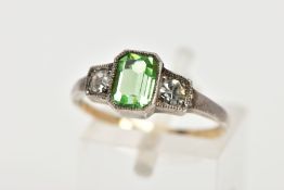 A PASTE SET RING, three stone ring set with a green coloured paste rectangular cut and two