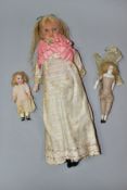 A LATE NINETEENTH CENTURY WAX HEAD DOLL WITH TWO SMALL BISQUE HEAD DOLLS, comprising larger,