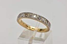 A YELLOW METAL DIAMOND HALF ETERNITY RING, designed with a row of nine round brilliant cut diamonds,