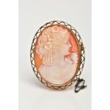 A PORTRAIT CAMEO BROOCH, set in an a 9ct gold open work mount, portrait depicting a lady facing to