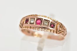 AN EARLY 20TH CENTURY 9CT GOLD FIVE STONE RING, designed with a row of three circular cut red