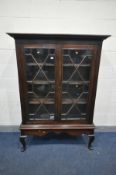 A GEORGIAN MAHOGANY BOOKCASE, with double geometric astragal glazed doors, enclosing a fitted