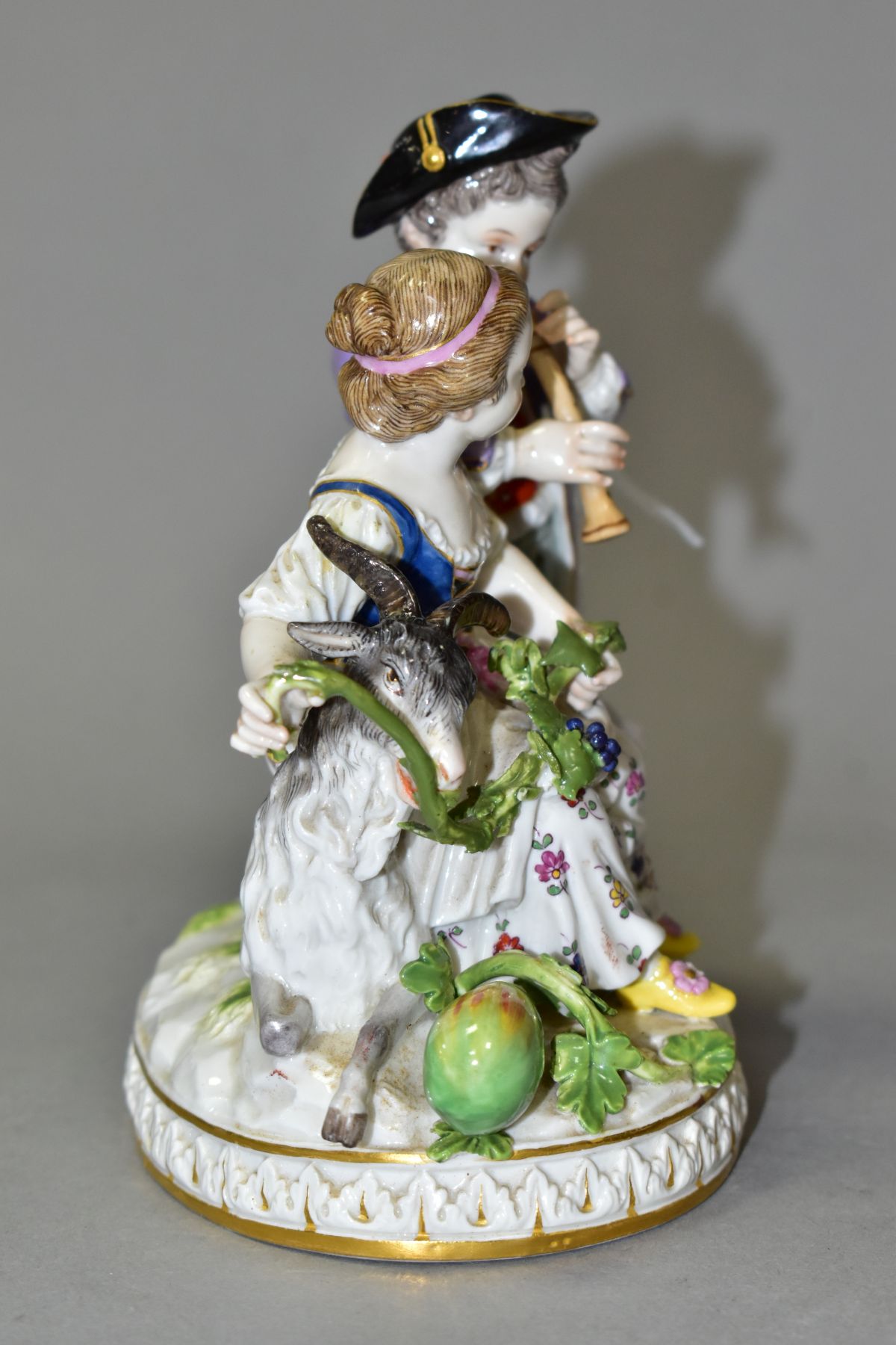 A LATE 19TH CENTURY MEISSEN FIGURE GROUP OF A BOY AND A GIRL WITH A GOAT, the boy playing a wind - Image 2 of 11