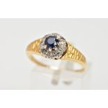 AN 18CT GOLD SAPPHIRE AND DIAMOND CLUSTER RING, centring on an eight claw set, circular cut blue