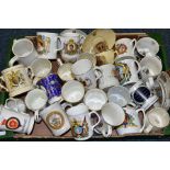 A BOX OF ROYAL COMMEMORATIVE CERAMIC WARES, to include over thirty pieces, two mugs designed by Dame