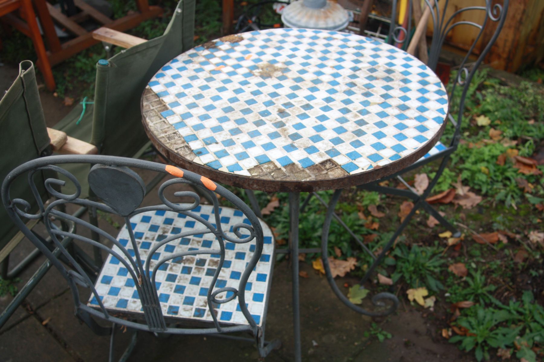 A METAL FRAMED CIRCULAR GARDEN TABLE with a mosaic tiled top, diameter 66cm x height 77cm (losses) - Image 2 of 2