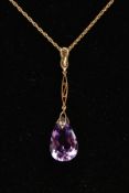 AN AMETHYST PENDANT AND 9CT GOLD CHAIN, a faceted tear drop pendant fitted with an elongated open