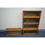 AN EARLY 20TH CENTURY OAK FIVE PIECE SECTIONAL BOOKCASE, with hide and fall glass doors, no base and