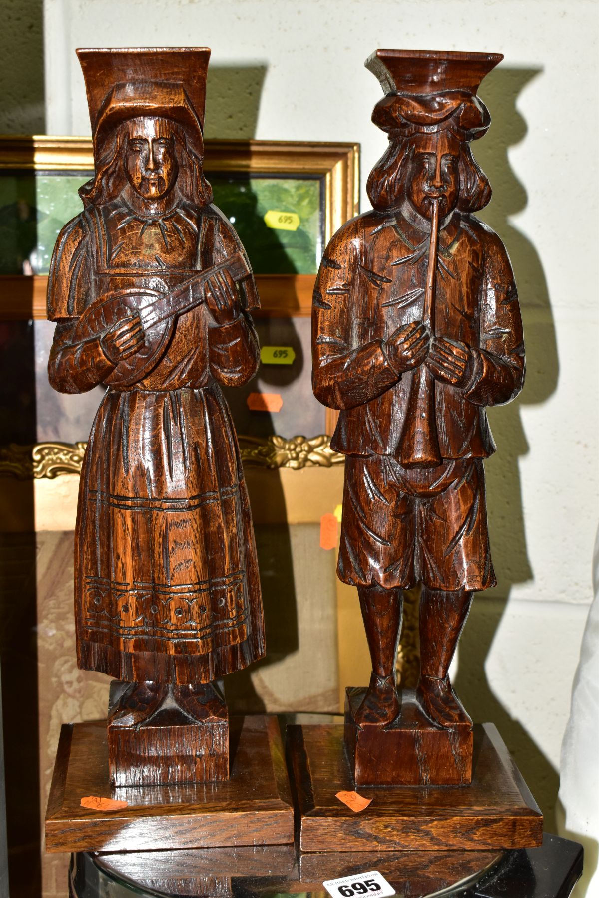 A PAIR OF CARVED OAK CORBELS OF MALE AND FEMALE MUSICIANS TOGETHER WITH THREE PICTURES AND A PEDAL - Image 2 of 5