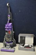 A DYSON DC15 ANIMAL (PAT pass and working) along with a boxed Dyson home cleaning kit (2)