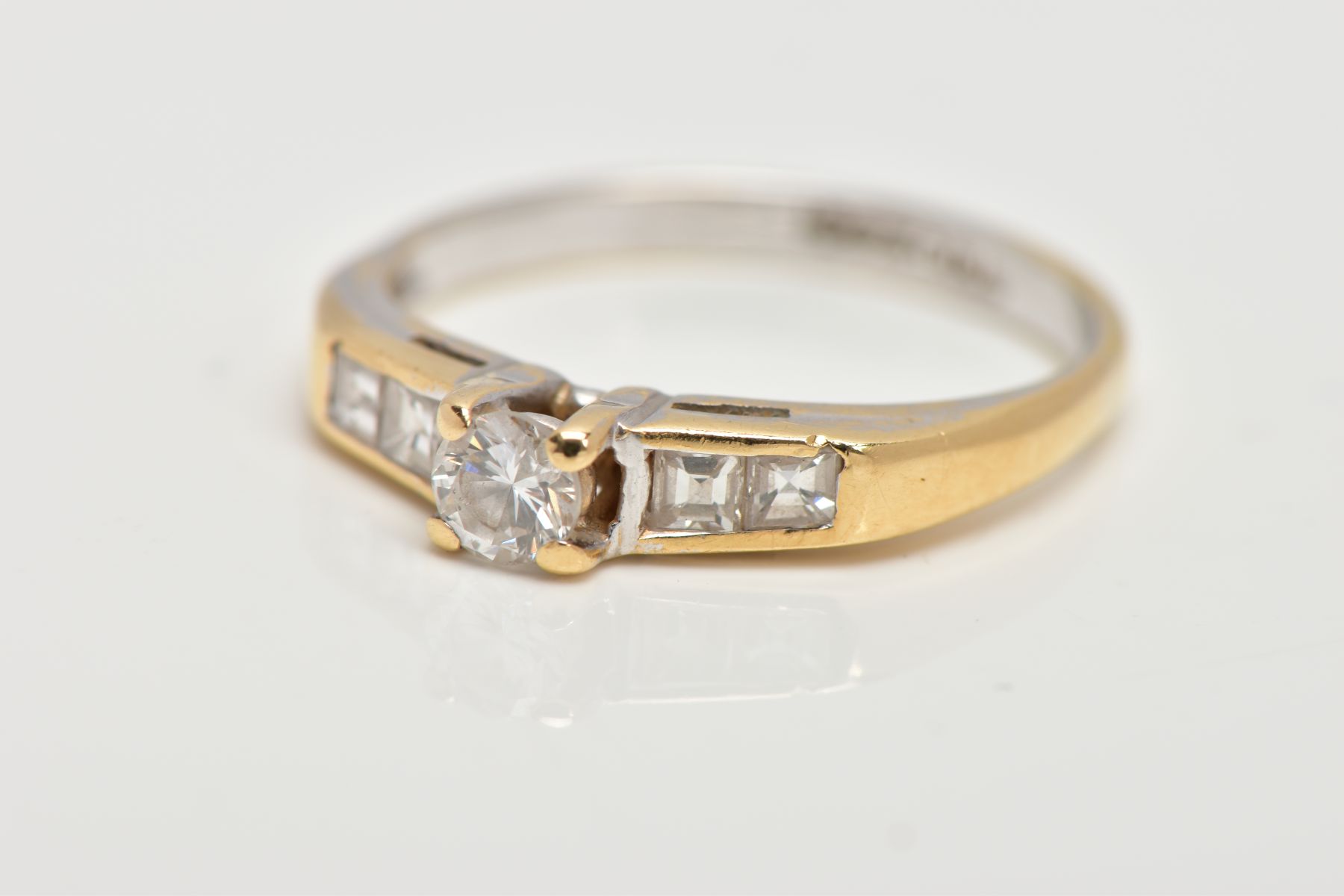 A DIAMOND RING, designed with a central brilliant cut diamond in a four claw setting, flanked by two - Image 6 of 6