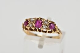 AN EARLY 20TH CENTURY RUBY AND DIAMOND RING, 18ct gold ring set with one cushion cut ruby and two