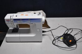 AN ALPHA MODELO 1412 SEWING MACHINE with treadle and power cable along with a soft cover (not PAT