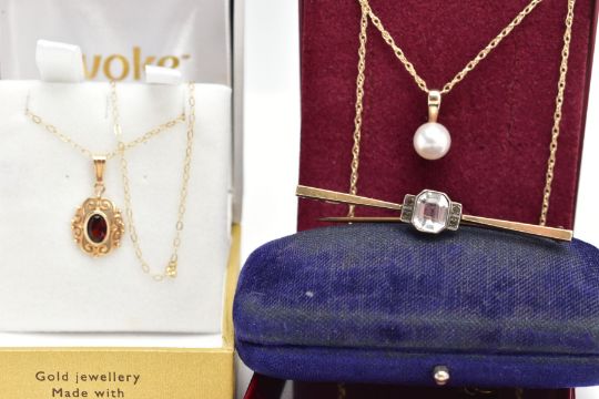 TWO NECKLACES AND A BAR BROOCH, to include a bezel set oval cut garnet in an open work scroll - Image 1 of 4