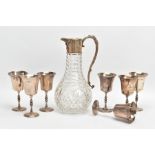 A SET OF SILVER GOBLETS AND A GLASS WINE JUG, seven silver goblets with knopped steams and flaring