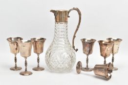 A SET OF SILVER GOBLETS AND A GLASS WINE JUG, seven silver goblets with knopped steams and flaring