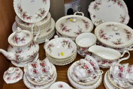 A SIXTY TWO PIECE ROYAL ALBERT LAVENDER ROSE PART DINNER SERVICE, comprising two tureens, sauce