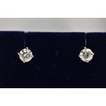 A MODERN PAIR OF 18CT WHITE GOLD DIAMOND STUD EARRINGS, estimated total modern round brilliant cut